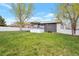 Spacious backyard featuring a well-maintained lawn at 2055 Quail Dr, Lakewood, CO 80215