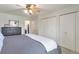 Serene bedroom with a comfortable bed, neutral tones, ample closet space, and a ceiling fan at 2055 Quail Dr, Lakewood, CO 80215