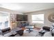 Inviting living room with a spacious layout, plush seating, and a large window providing natural light at 2055 Quail Dr, Lakewood, CO 80215