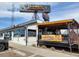 Exterior view of the restaurant featuring outdoor patio and Gold's Marketplace sign at 2055 Quail Dr, Lakewood, CO 80215