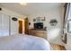 Cozy bedroom is complete with hardwood floors, a large window, and dresser at 6995 W 27Th Ave, Wheat Ridge, CO 80033