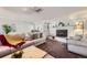 Cozy living room with fireplace, comfortable seating, and natural light at 6995 W 27Th Ave, Wheat Ridge, CO 80033