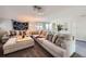 Spacious living room with plush seating and neutral decor at 6995 W 27Th Ave, Wheat Ridge, CO 80033