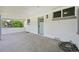 Covered back porch with brick siding, a blue door, and an outdoor light fixture at 169 Yates St, Denver, CO 80219