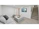 Cozy finished basement featuring neutral colors, plush carpeting, and a comfortable sitting area at 169 Yates St, Denver, CO 80219