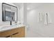 Stylish half bathroom with contemporary vanity and a view into the powder room at 169 Yates St, Denver, CO 80219