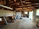 Spacious detached garage with ample storage, garage door, and concrete flooring at 169 Yates St, Denver, CO 80219