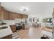 Well-lit kitchen connected to the living area, boasting stainless steel appliances and modern cabinetry at 169 Yates St, Denver, CO 80219