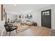 Bright living room with hardwood floors, a large window, and stylish furniture at 169 Yates St, Denver, CO 80219