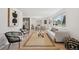 Open-concept living space with dining area, stylish decor, and ample natural light at 169 Yates St, Denver, CO 80219