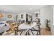 Spacious living area with dining space, modern lighting, and open access to the kitchen at 169 Yates St, Denver, CO 80219