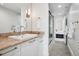 Modern bathroom with walk-in shower, granite countertops, and access to the bedroom at 512 Cook St, Denver, CO 80206