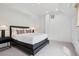 Modern bedroom with a minimalist design with recessed lighting and neutral color tones at 512 Cook St, Denver, CO 80206
