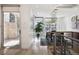 Hallway view leading to the dining room with large windows and a glass door at 512 Cook St, Denver, CO 80206