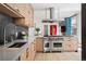 Gourmet kitchen featuring stainless steel appliances, modern cabinetry, and a spacious countertop at 512 Cook St, Denver, CO 80206