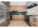 Well-appointed kitchen boasting stainless steel appliances, sleek cabinetry, and ample counter space at 512 Cook St, Denver, CO 80206
