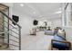 Spacious and stylish living room with stairs, a bar, and comfortable seating arrangements at 512 Cook St, Denver, CO 80206