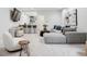 Comfortable living room featuring a bar, gray sectional sofa, and unique decor elements at 512 Cook St, Denver, CO 80206