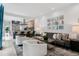 Stylish living room showcasing an open layout, modern decor, and seamless flow to the gourmet kitchen at 512 Cook St, Denver, CO 80206