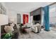 Cozy living room with modern decor, a fireplace, and plenty of natural light at 512 Cook St, Denver, CO 80206