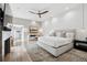 Spacious main bedroom with a sitting area, fireplace, and ample natural light at 512 Cook St, Denver, CO 80206