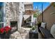 Charming outdoor patio with a stone fireplace, comfortable seating, and a cozy ambiance at 512 Cook St, Denver, CO 80206