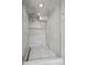 Modern walk-in shower with dual shower heads and tiled walls and floor at 512 Cook St, Denver, CO 80206