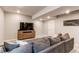 Spacious finished basement with comfortable seating, recessed lights, and an egress window at 21302 E Radcliff Pl, Aurora, CO 80015