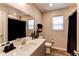 Bright bathroom features wood look floors and white counter at 21302 E Radcliff Pl, Aurora, CO 80015