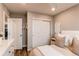 Relaxing bedroom features a comfortable bed, closet, and chic neutral decor at 21302 E Radcliff Pl, Aurora, CO 80015