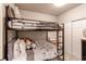 bedroom features bunk beds and closet at 21302 E Radcliff Pl, Aurora, CO 80015