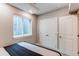 Cozy bedroom features a large window and neutral walls at 21302 E Radcliff Pl, Aurora, CO 80015