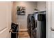 Convenient laundry room is equipped with a modern washer and dryer at 21302 E Radcliff Pl, Aurora, CO 80015