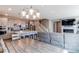 Open-concept living space connects kitchen, dining, and living areas for seamless entertaining at 21302 E Radcliff Pl, Aurora, CO 80015