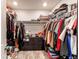 Walk-in closet with ample storage space, multiple shelves, drawers, and rods to organize your wardrobe at 21302 E Radcliff Pl, Aurora, CO 80015