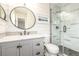 Charming bathroom featuring modern sink, vanity, and tiled shower at 10723 Sperry St, Northglenn, CO 80234