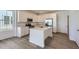 Eat-in kitchen with stainless steel appliances, granite countertops, and ample natural light at 728 N Bently St, Watkins, CO 80137