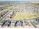 An aerial view of the property highlighting the community, a park, roads and neighborhood at 17614 Cherokee St, Broomfield, CO 80023