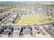 Aerial view of property showcasing community park, nearby homes and solar panels at 17614 Cherokee St, Broomfield, CO 80023