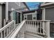 Relaxing deck with pergola, string lights, and sliding door entrance into the home at 17614 Cherokee St, Broomfield, CO 80023
