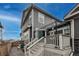 Backyard view highlighting the deck, pergola, and siding of this lovely home at 17614 Cherokee St, Broomfield, CO 80023