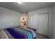 Comfortable bedroom with closet and doorway to the hallway and stairs at 17614 Cherokee St, Broomfield, CO 80023