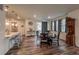 Well-lit dining area with hardwood floors and access to the kitchen at 17614 Cherokee St, Broomfield, CO 80023