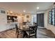 Bright dining area open to kitchen, featuring hardwood floors at 17614 Cherokee St, Broomfield, CO 80023