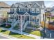 Charming townhome showcasing a well-maintained lawn and inviting front porch at 17614 Cherokee St, Broomfield, CO 80023