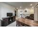Relaxing upstairs landing boasts cozy chair, rustic desk, and stylish decor creating an inviting space at 17614 Cherokee St, Broomfield, CO 80023