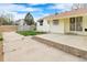 Spacious backyard with a concrete patio, fenced yard, and ample space for outdoor entertaining at 12116 N Fairfax St, Thornton, CO 80241
