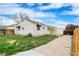 Spacious backyard with a concrete patio, fenced yard, with views of neighboring houses at 12116 N Fairfax St, Thornton, CO 80241