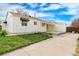 Spacious backyard with a concrete patio, fenced yard, and ample space for outdoor entertaining at 12116 N Fairfax St, Thornton, CO 80241