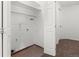 Functional laundry room with shelving for storage at 12116 N Fairfax St, Thornton, CO 80241